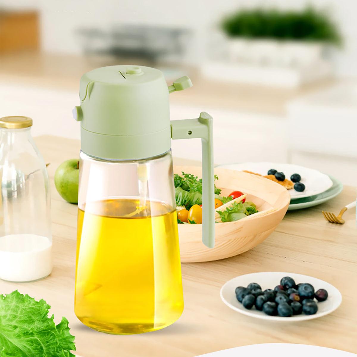 2-in-1 Bake & Spray Oil Dispenser - Green dispenser filled with oil on a kitchen counter.