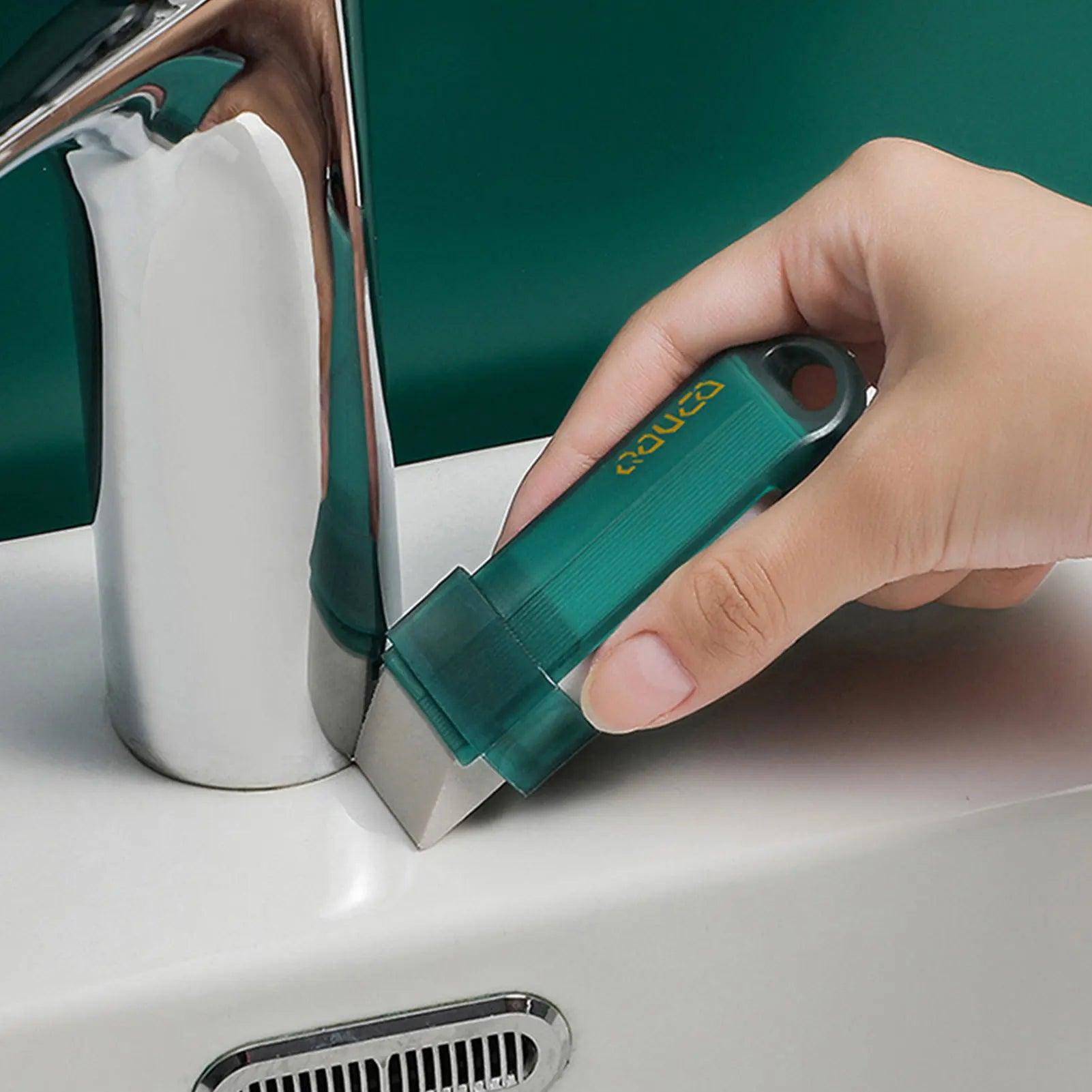 All-Purpose Cleaning Tool - Erasing grime from a kitchen sink with the green eraser.