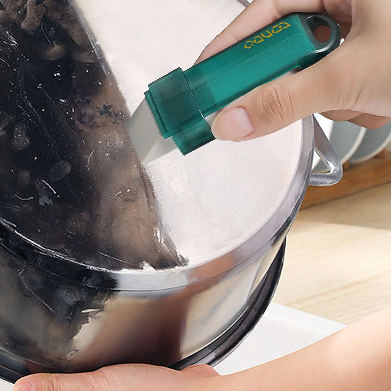 All-Purpose Cleaning Tool - Cleaning tough grease stains on a stove with the eraser.