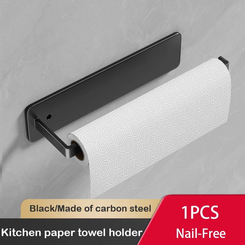 Wall-mounted black space-saving kitchen rack holding a paper towel roll.